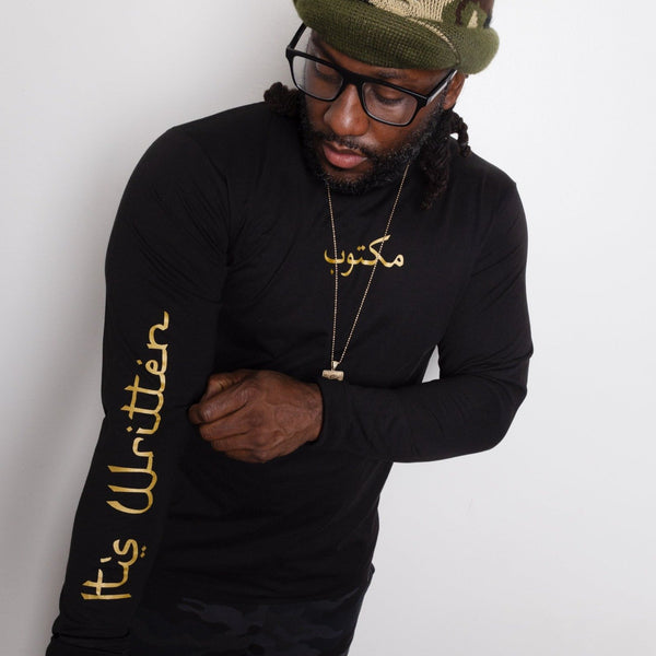 Black Arabic Longsleeve Maktoob Shirt with gold print. Maktoob on front, its written on the sleeve, destined for greatness on the upper back. Made with 100% airlume combed ringspun cotton, side seamed and ribbed cuffs. True to size